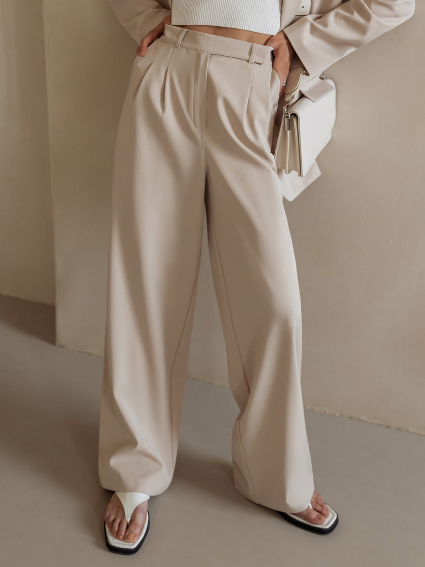 White wide-leg high-waist pants for women by FJØRNA, featuring a stylish high-waist design and flowing wide-leg silhouette.