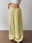 FJØRNA women's lightweight summer trousers with wide leg, drawstring waist, and elastic band for a casual, comfortable fit.