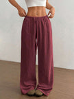 FJØRNA women's lightweight summer trousers with wide leg, drawstring waist, elastic band, casual style, in beige fabric.