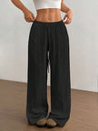 FJØRNA women's lightweight summer trousers with wide leg, drawstring waist, and elastic band for casual comfort.