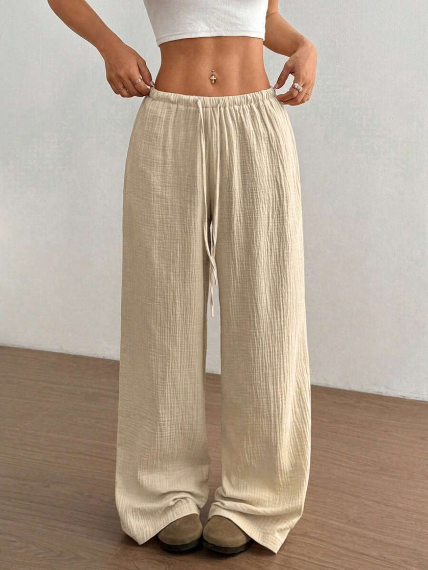 FJØRNA women's lightweight summer trousers with wide leg, drawstring waist, and elastic waistband, casual and comfortable for warm weather.