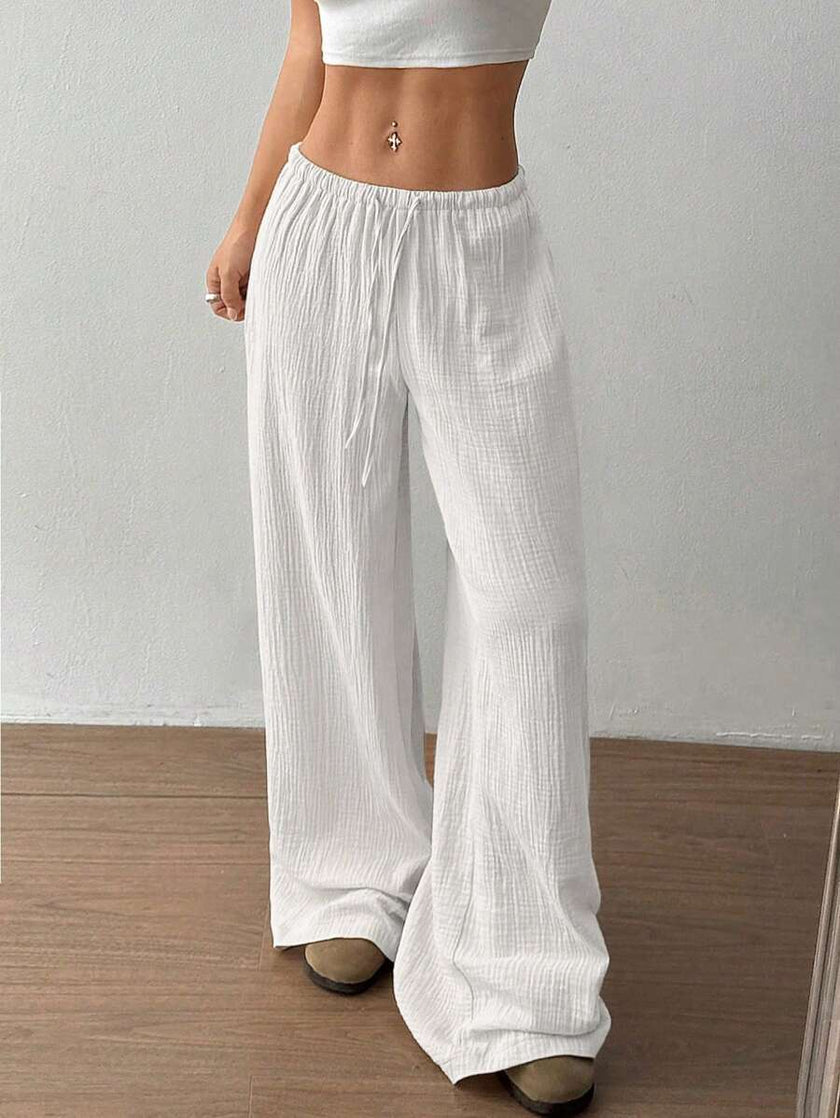 FJØRNA women's lightweight summer trousers with wide leg, drawstring waist, elastic waistband, casual style, soft fabric.