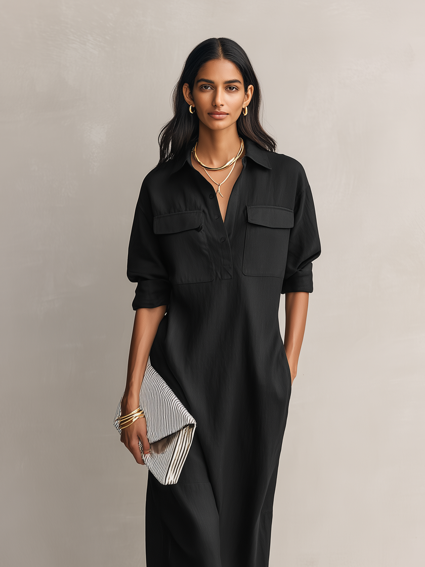 Woman wearing a black linen midi dress by FJØRNA, showcasing the elegant evening dress with long dark hair.