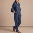 Navy blue FJØRNA women's two-piece co-ord set with button-front top and matching pants, stylish and elegant casual outfit.