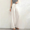 FJØRNA women's lightweight summer trousers with high waist, wide-leg fit, and button front detail