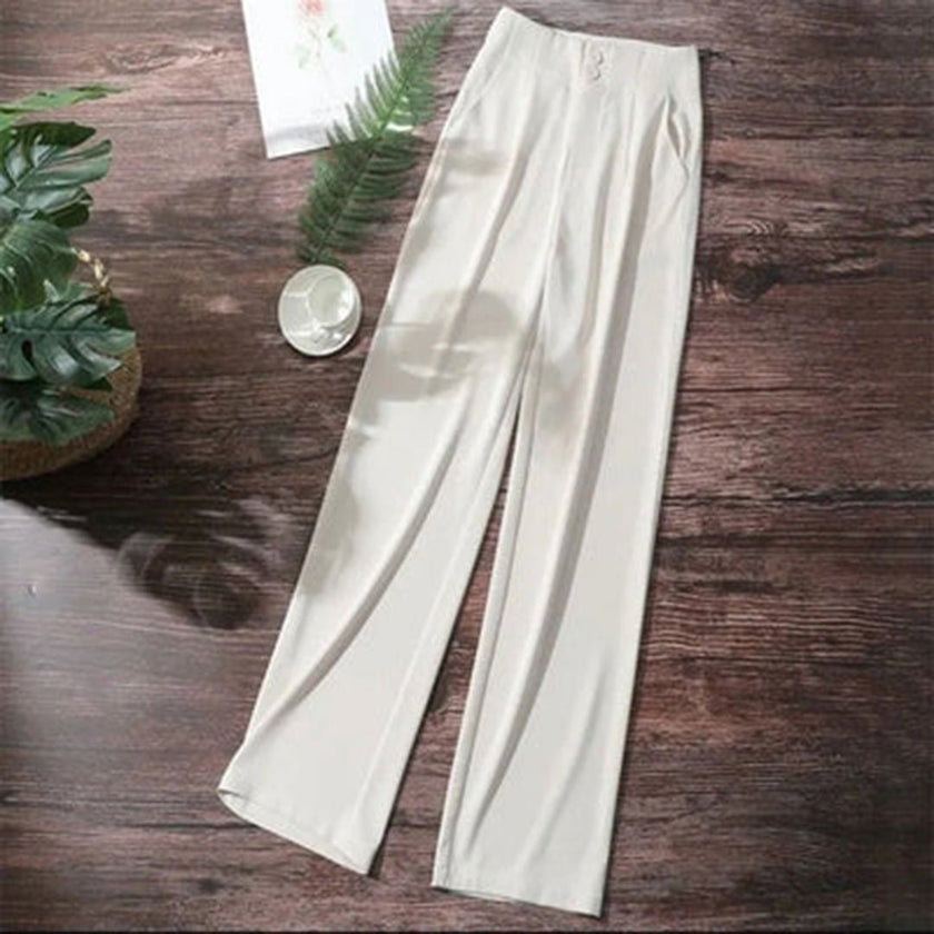 FJØRNA women's lightweight summer trousers with high waist and wide-leg design, featuring a button front and relaxed fit.