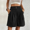 FJØRNA lightweight summer women's shorts with wide leg and high waist, shown in a natural outdoor setting.