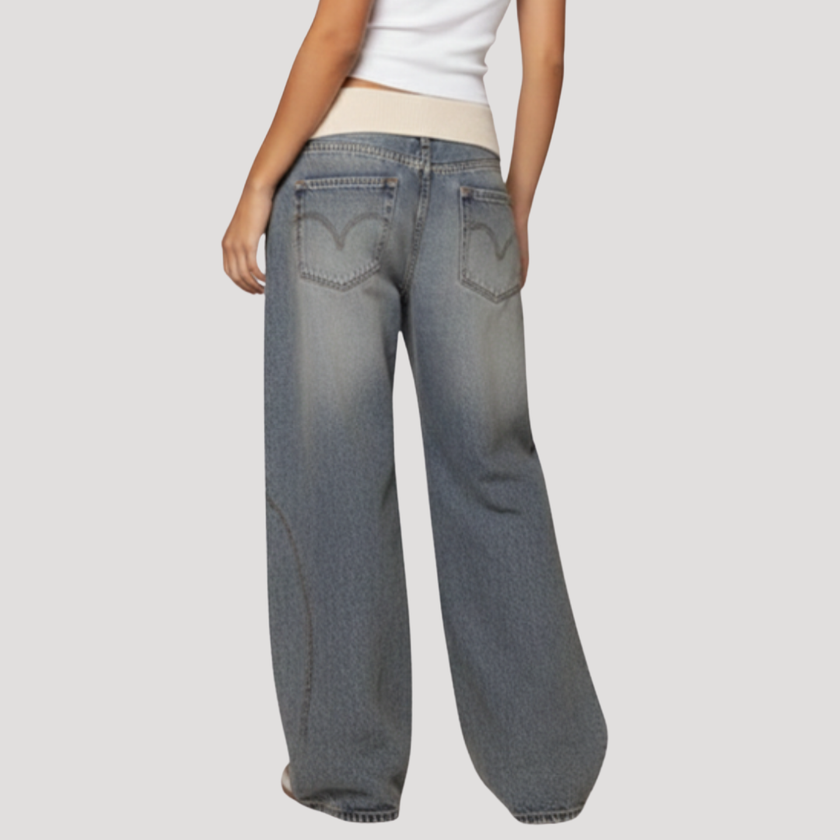 Lightweight summer women's jeans by FJØRNA featuring wide-leg, baggy fit and casual style, shown in a natural pose.