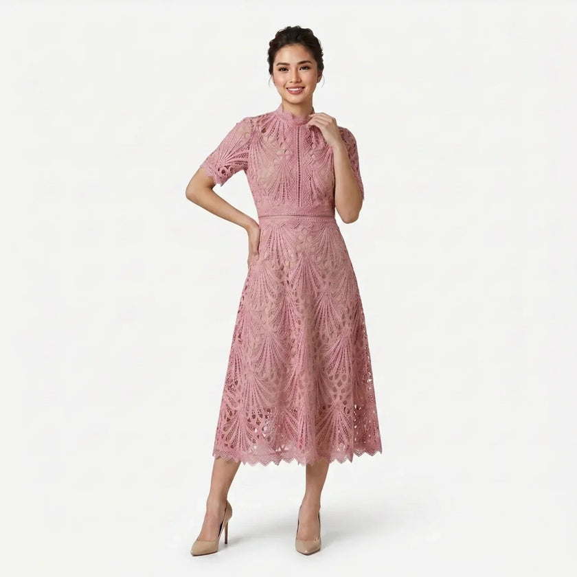 Women's elegant lace midi dress by FJØRNA featuring a high neck silhouette and intricate cutwork detail.