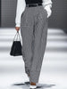 White houndstooth tailored women's straight-leg trousers by FJØRNA, shown as crisp, professional pants on a neutral background.