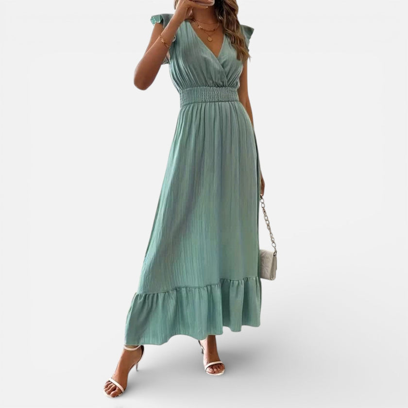 Flowy women's sleeveless maxi dress by FJØRNA featuring a timeless, elegant fit and lightweight fabric, perfect for warm weather.