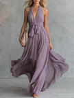 Elegant chiffon halter neck maxi dress by FJØRNA, featuring a flowing silhouette and sophisticated evening wear style.