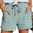 Lightweight women's summer shorts by FJØRNA featuring wide-leg style and adjustable drawstring waist, perfect for warm weather.