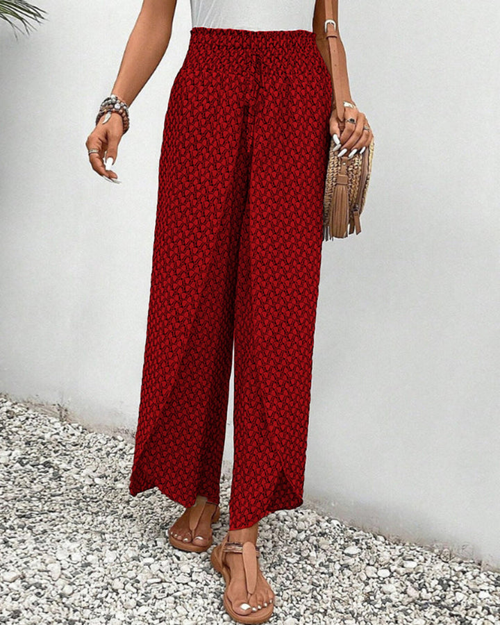 Red lightweight summer trousers for women by FJØRNA, wide-leg and breathable, perfect for warm weather and casual wear.
