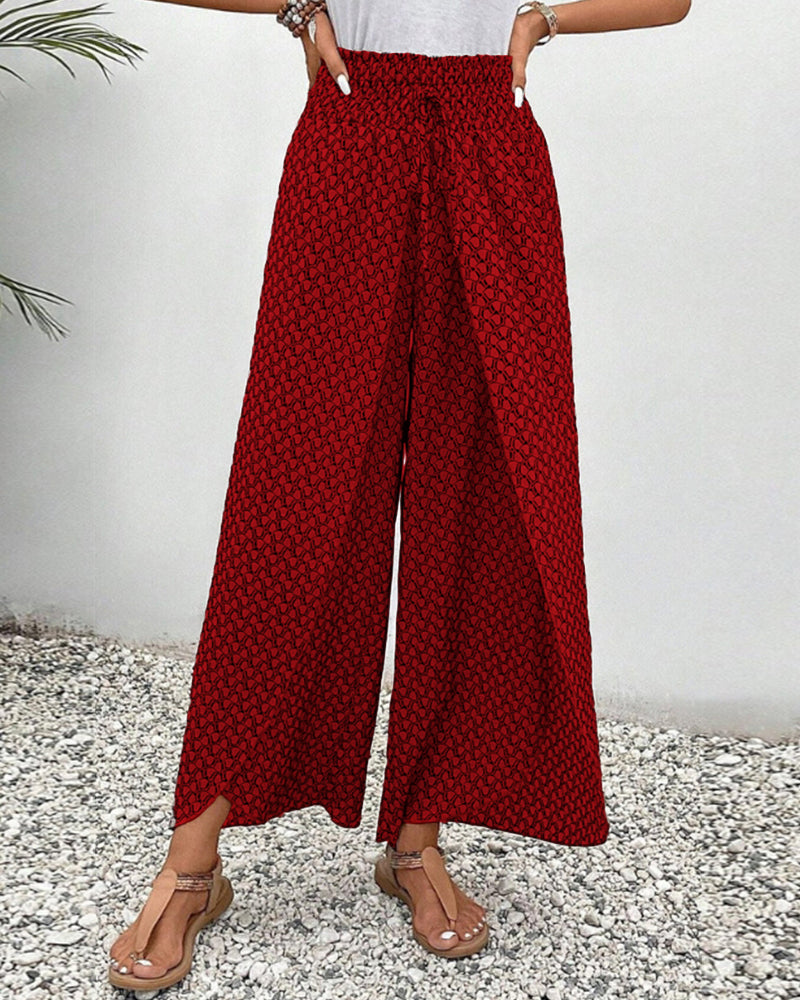 Red FJØRNA women's lightweight summer trousers with wide leg design, breathable fabric, perfect for warm weather.