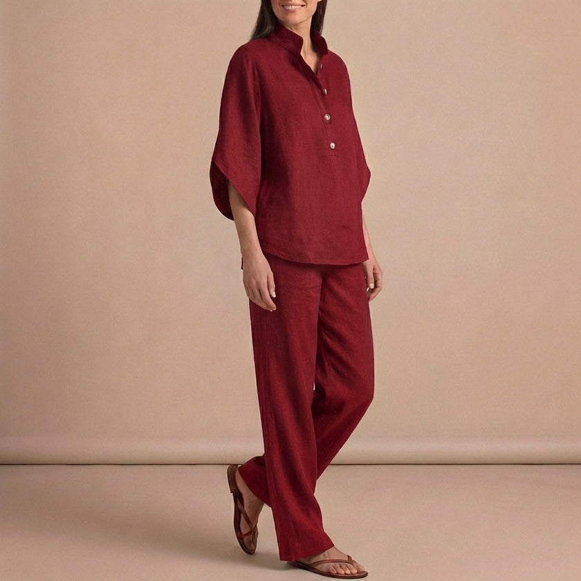 Red FJØRNA women's two-piece co-ord set featuring a button-front top and matching pants, stylish and elegant for diverse occasions.