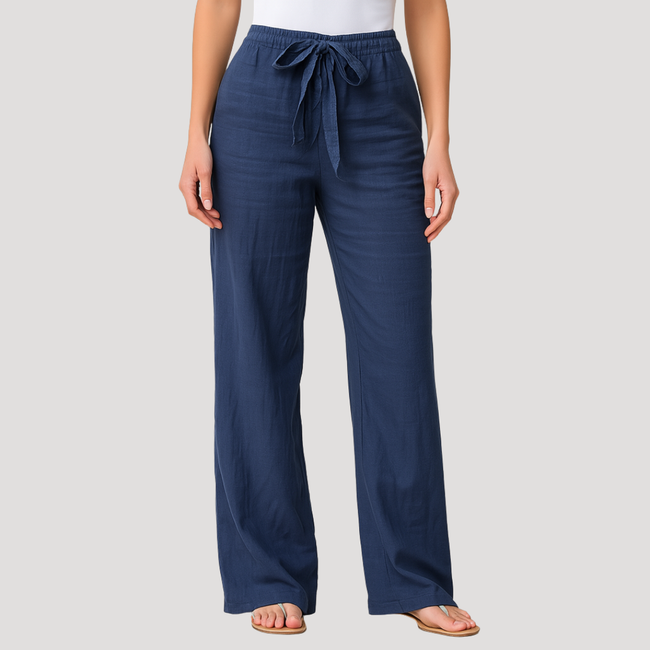 FJØRNA women's lightweight summer trousers with wide legs, drawstring waist, and side pockets for a breezy, comfortable look.
