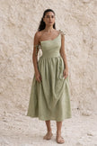 Sage green boho maxi dress by FJØRNA with flowing fabric and relaxed fit, perfect for casual summer wear.