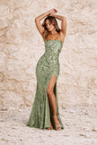 Sage green floral dress by FJØRNA with a flowy silhouette and delicate floral pattern, perfect for spring and summer occasions.