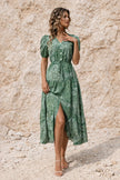Sage green FJØRNA flowy dress with lightweight fabric, long sleeves, and a relaxed, elegant silhouette.