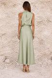 FJØRNA sage green satin dress with elegant fit and flowy fabric, suitable for formal or evening occasions.