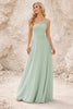 Sage green bridesmaid dress by FJØRNA featuring a flowing gown with elegant fabric and a fitted bodice.