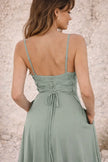Dusty sage green FJØRNA dress featuring a soft, flowing fabric and elegant design, perfect for casual or semi-formal wear.