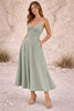 Dusty sage green FJØRNA dress featuring a flowing design and soft fabric, perfect for casual or semi-formal wear.