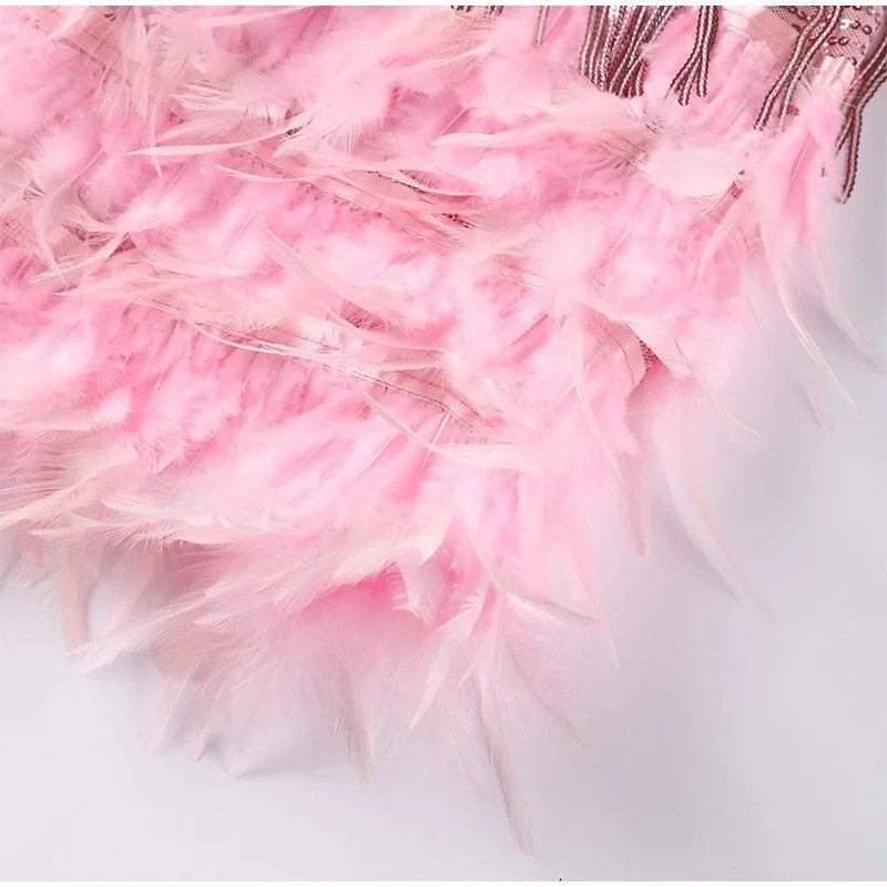 Elegant FJØRNA mini fringe cocktail dress for women, featuring stylish design perfect for parties and special occasions.