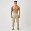 Men's tailored cream trousers by FJØRNA, showcasing a sleek fit and classic design, perfect for formal or smart casual wear.