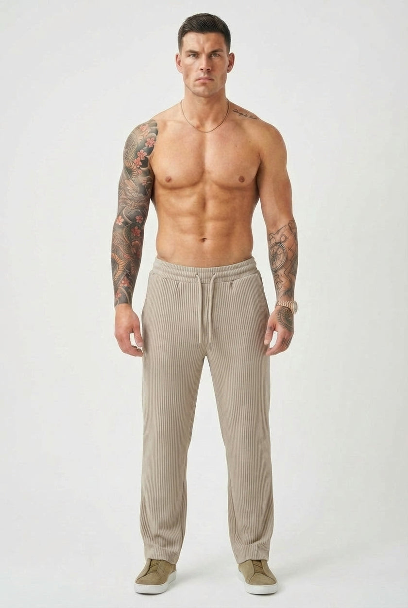 Men's relaxed knit trousers in khaki by FJØRNA, featuring a comfortable fit and casual style.