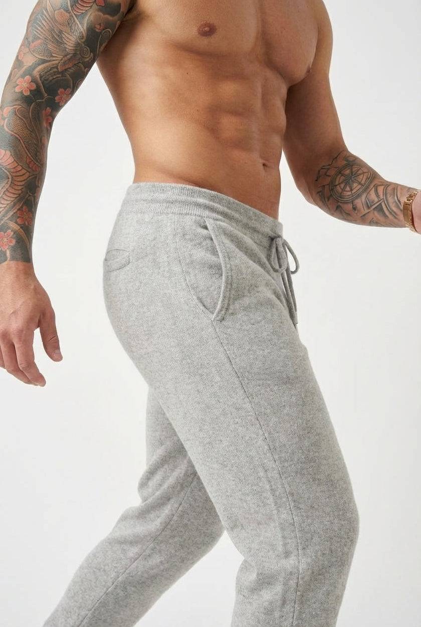 Men's FJØRNA Merino Wool trousers in light grey, stylish and comfortable pants with a tailored fit and soft texture.