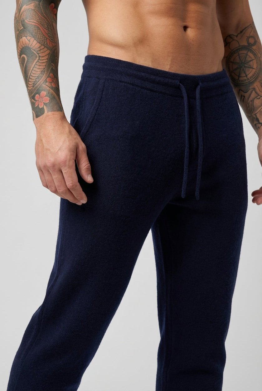 Men's navy Merino wool trousers by FJØRNA, stylish and comfortable pants for casual or formal wear, seen from front view.