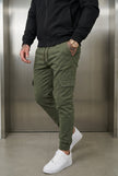 Men's cargo jogger trousers in army green by FJØRNA, featuring relaxed fit and multiple pockets for casual comfort.