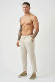 Men's cropped linen trousers in indigo by FJØRNA, featuring a comfortable fit and stylish design.