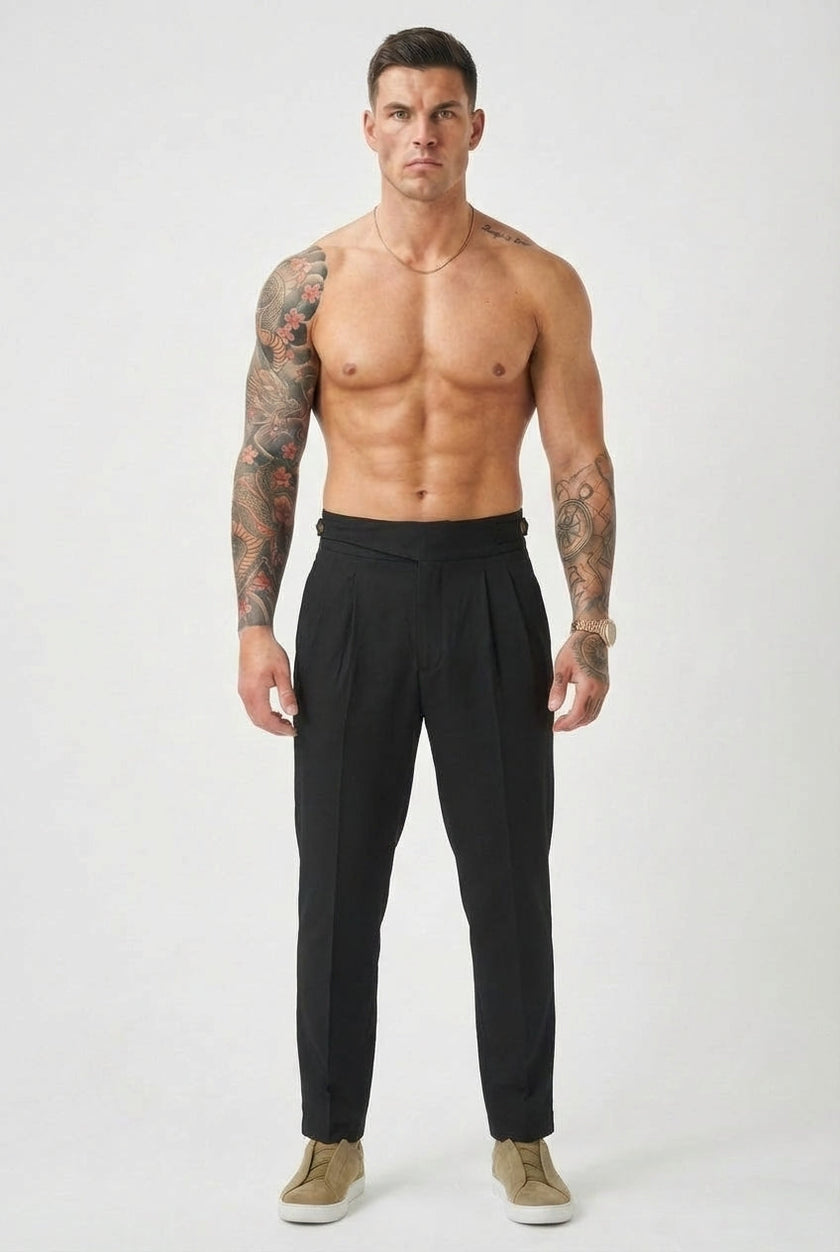 Men's black tailored trousers by FJØRNA, featuring a slim fit and modern design, shown on a model.