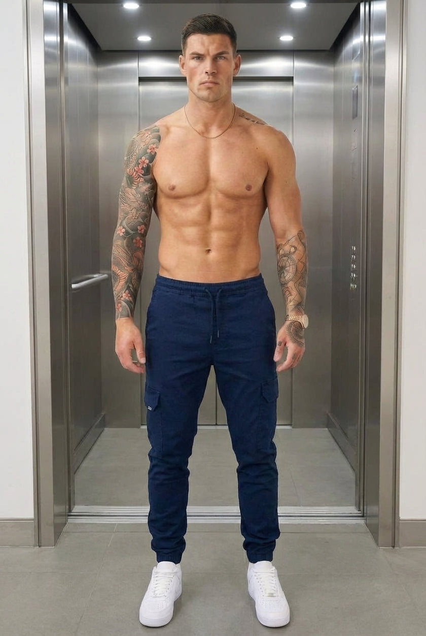 Men's navy cargo jogger trousers by FJØRNA, showing relaxed fit, multiple pockets, and comfortable waistband.
