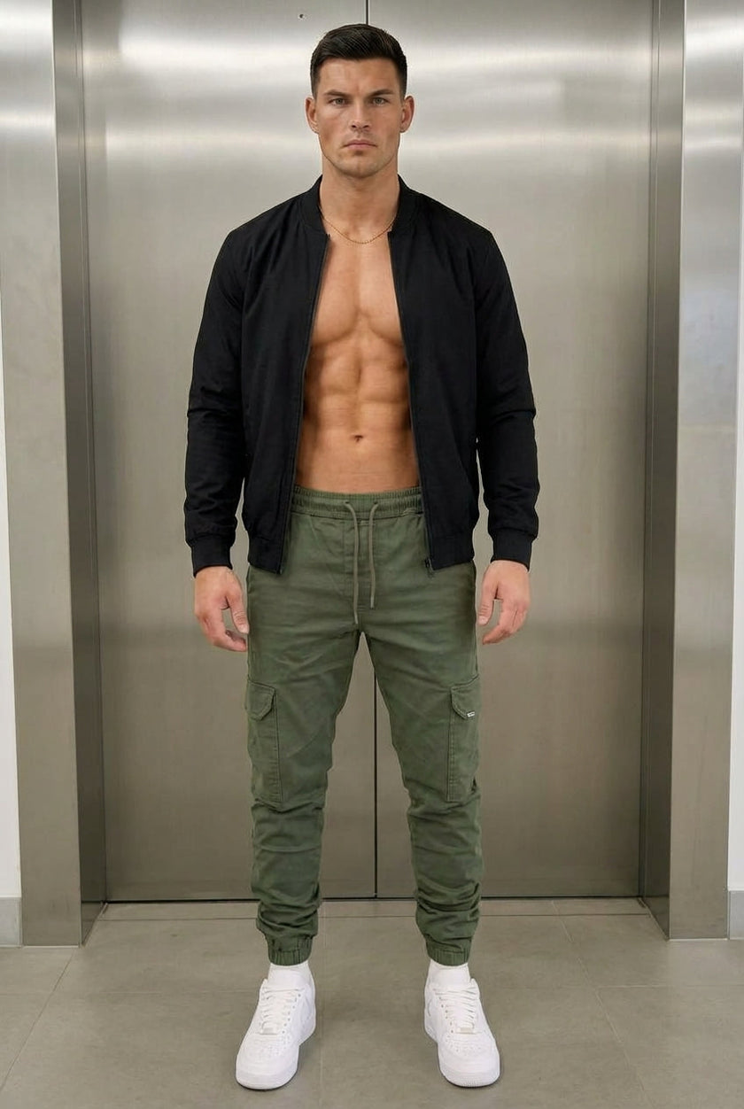 Men's cargo jogger trousers in army green by FJØRNA, featuring a relaxed fit and multiple utility pockets.