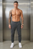 Men's grey cargo jogger trousers by FJØRNA featuring a relaxed fit and functional pockets in a casual, comfortable style.