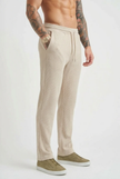 Men's relaxed knit khaki trousers by FJØRNA, shown in a casual fit with soft fabric and stylish design.