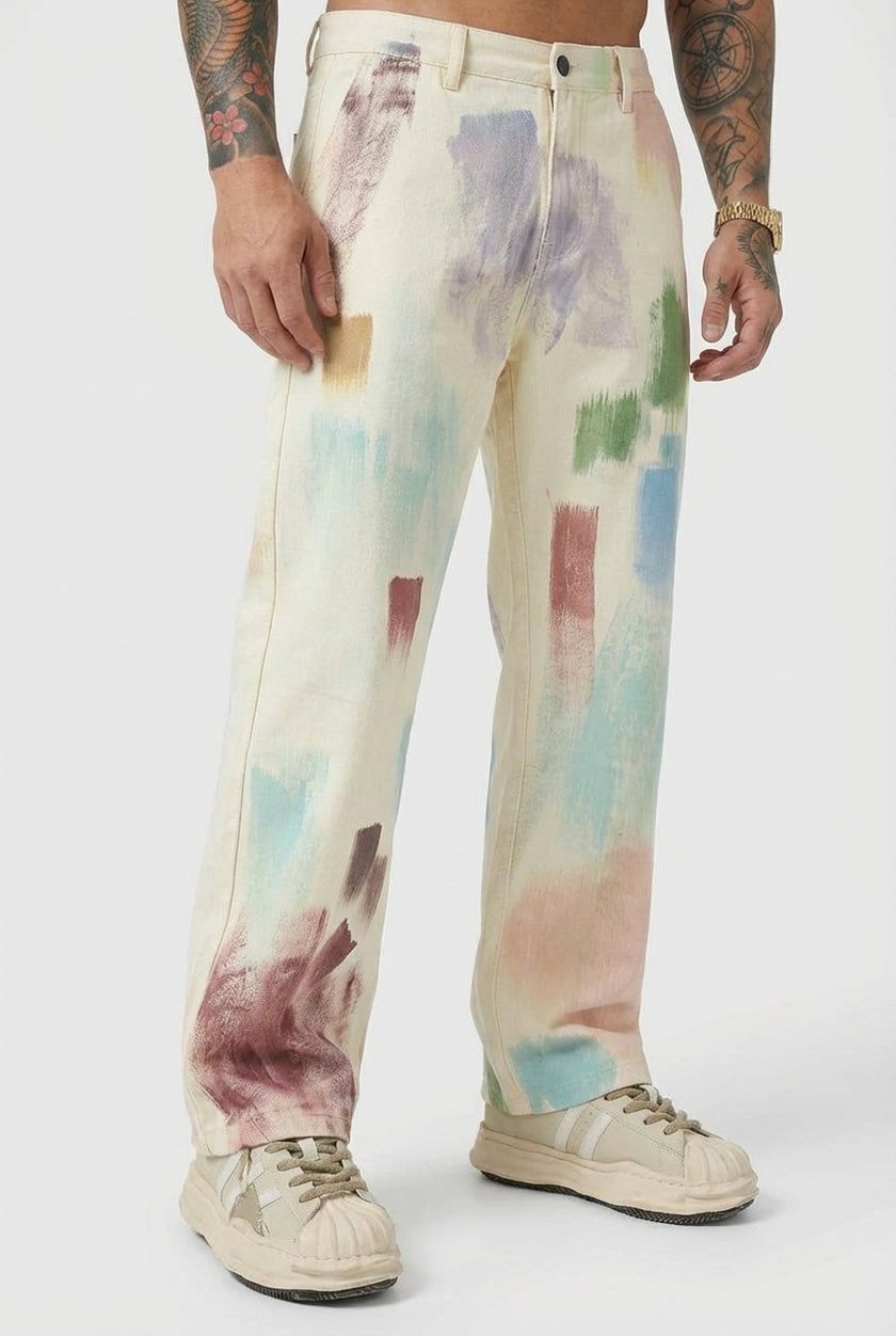 Black painted men's trousers by FJØRNA, featuring a stylish fit and detailed design, shown on a model.