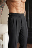 FJØRNA tailored black men's trousers displayed on model, showcasing slim fit and classic design for stylish professional look.