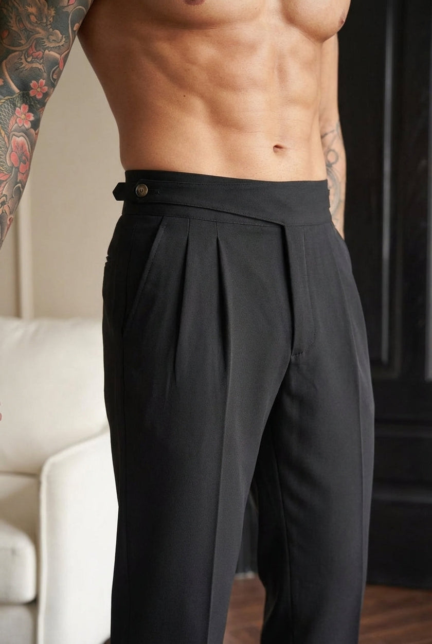 FJØRNA tailored black men's trousers displayed on model, showcasing slim fit and classic design for stylish professional look.