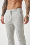 Men's Merino wool trousers in light grey by FJØRNA, featuring a tailored fit and smooth fabric, ideal for casual or office wear.