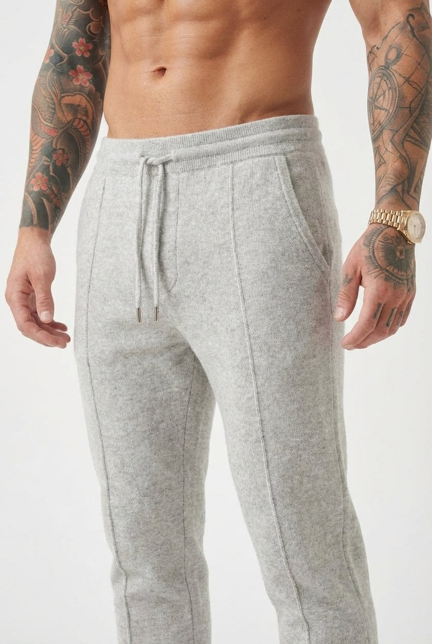 Men's Merino wool trousers in light grey by FJØRNA, featuring a tailored fit and smooth fabric, ideal for casual or office wear.