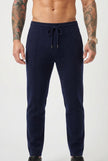 Men's navy merino wool trousers by FJØRNA, stylish and comfortable pants with a tailored fit for everyday wear.