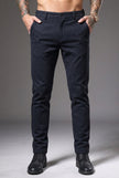 Slim-fit blue men's pants by FJØRNA, featuring a tailored fit and stylish design, shown on a model.