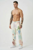 Men's black painted trousers by FJØRNA, showing the stylish design and fit of these modern pants in a close-up image.
