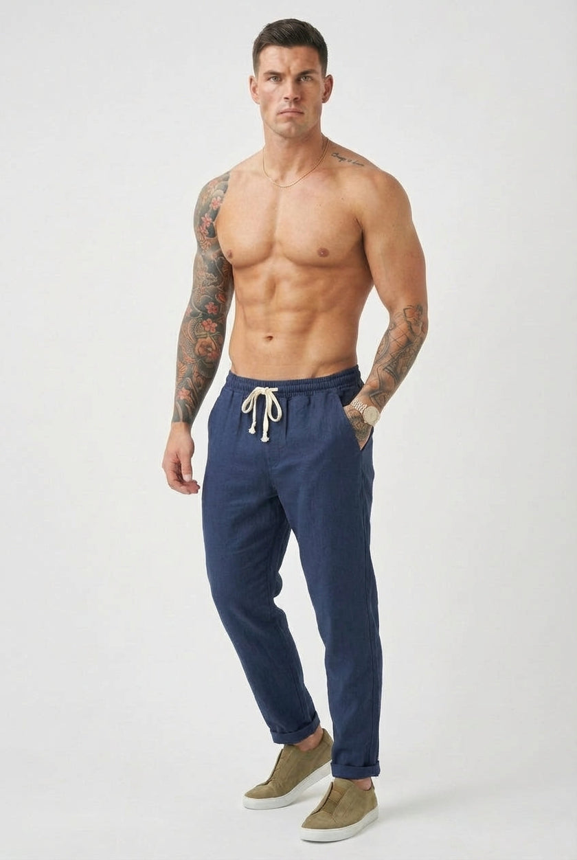 Men's linen tailored trousers by FJØRNA, featuring a sleek fit and natural fabric in a versatile neutral color.