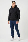 Men's navy cargo jogger trousers by FJØRNA featuring relaxed fit, multiple pockets, and comfortable fabric for casual wear.